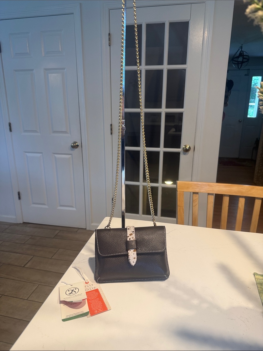 Black Pebbled Leather Crossbody Bag with Speckled Tab and Gold Chain